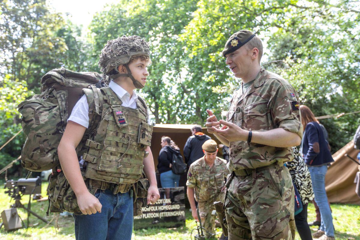 H&F Youth Mayor Albi Fenner tries on army uniform at H&F's D-Day celebrations 2024