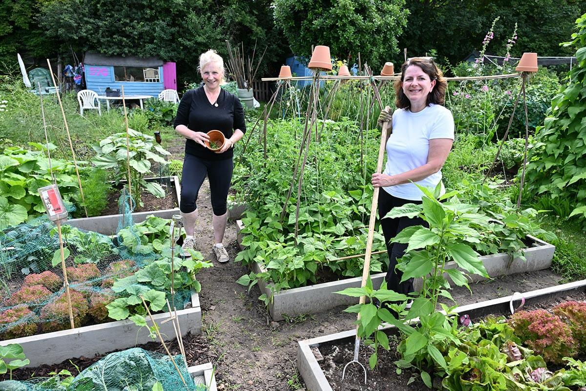 Emma Walker and Rose Craston working on their allotment