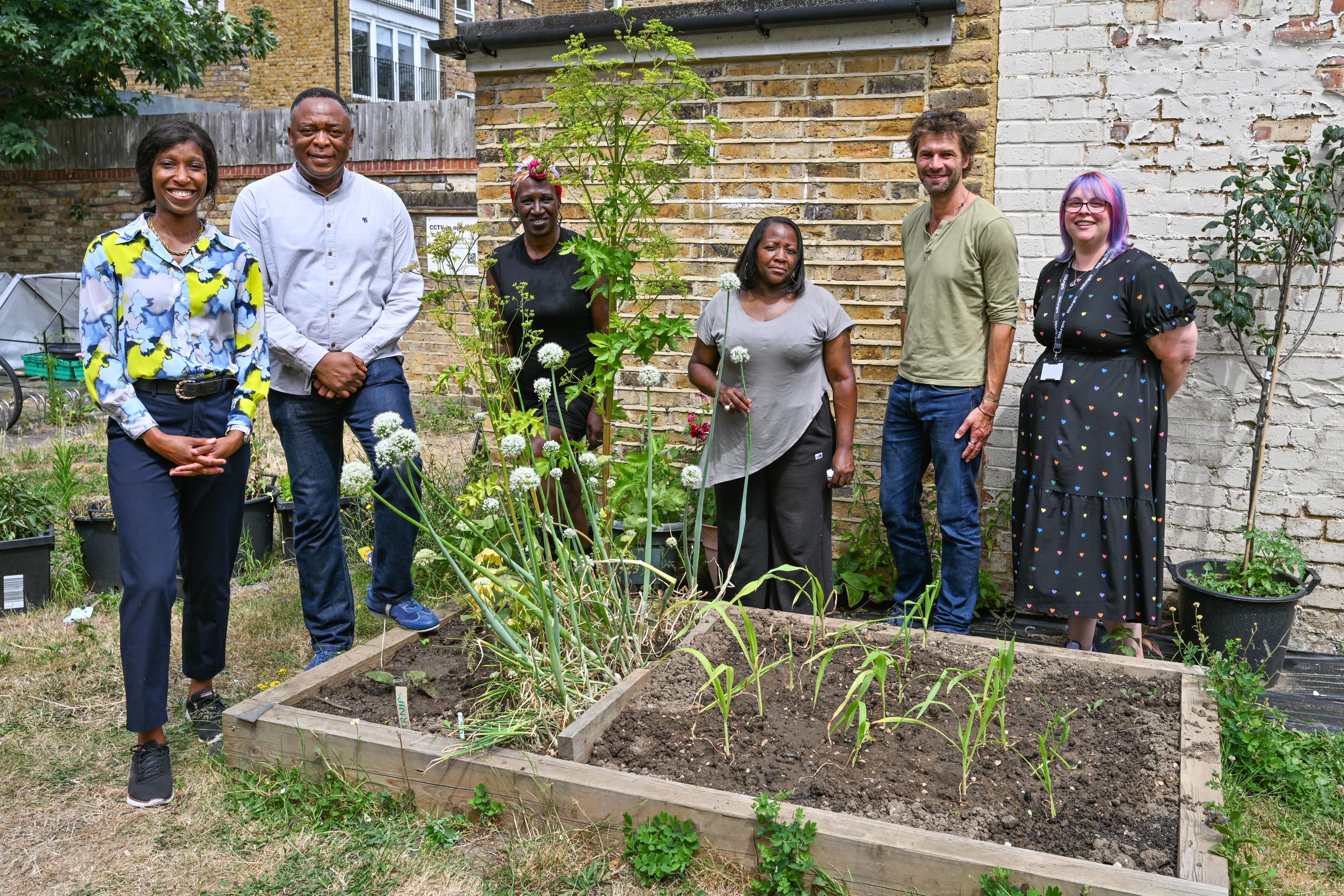 Cllr Frances Umeh (left), Cabinet Member for Housing and Homelessness, with St Mungo's staff at homeless supported accommodation in Fulham