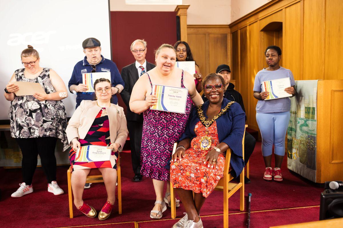 Mayor of H&F, Cllr Sharon Holder (seated right), with students receiving awards