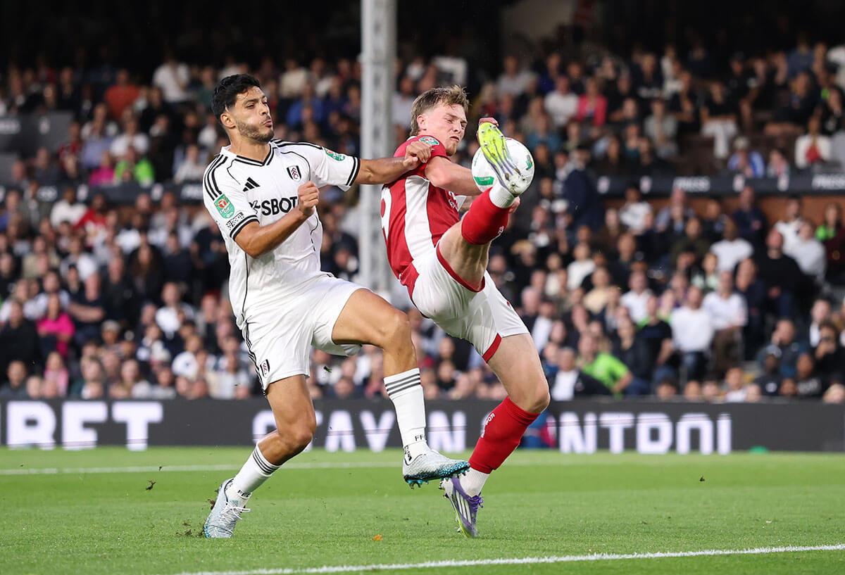 George Tanner of Bristol City (right) scores an own goal whilst under pressure from Raul Jimenez (left)