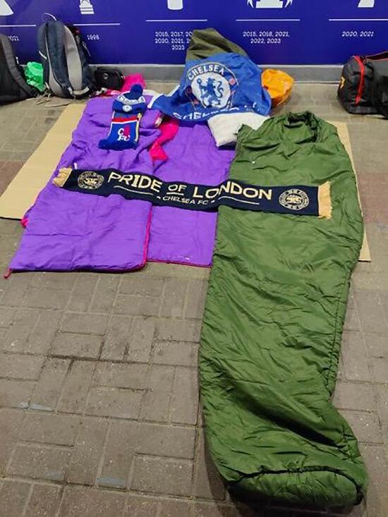 Sleeping bags on the concrete floor of the east stand concourse at Stamford Bridge