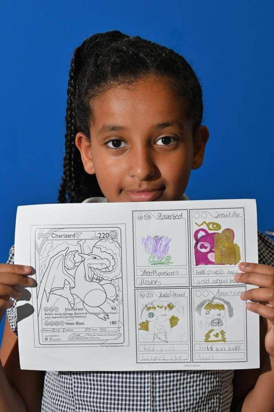 White City pupil Keeya (9) holds up her artwork