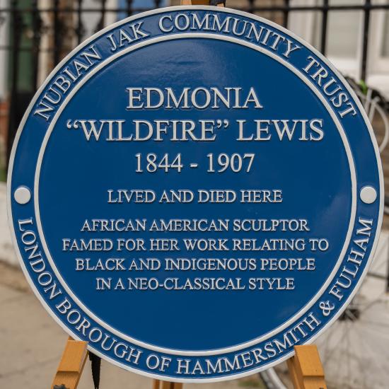 Plaque inscription: Edmonia 'Wildfire' Lewis, 1844-1907, lived and died here. African American sculptor famed for her work relating to black and indigenous people in a neo-classical style