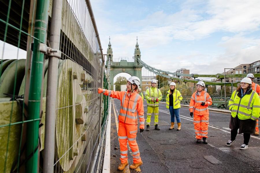 Camille demonstrating where the bridge was reinforced after a bombing.