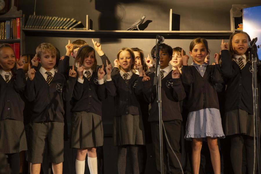 Students from St Peters Church of England Primary School performing a song at the event.