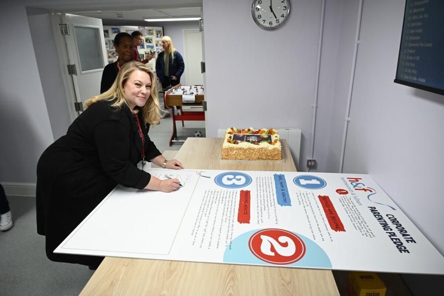 Cllr Sanderson signing H&F’s Corporate Parenting Pledge to all our care-experienced young people at the new Care Leaver's Hub.