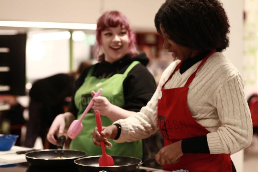 Residents having fun at the free NourishED cookery class