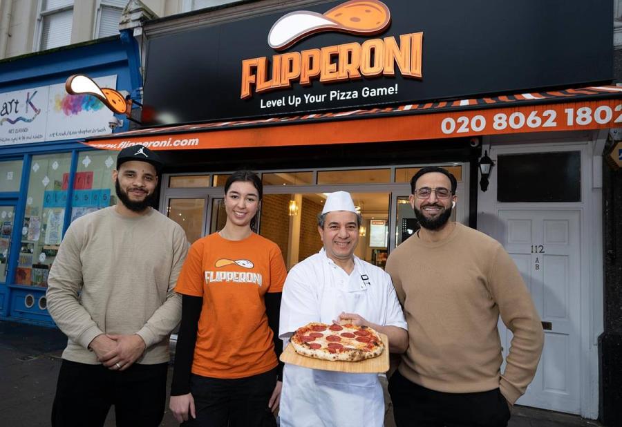 The team outside Flipperoni pizza parlour on Askew Road