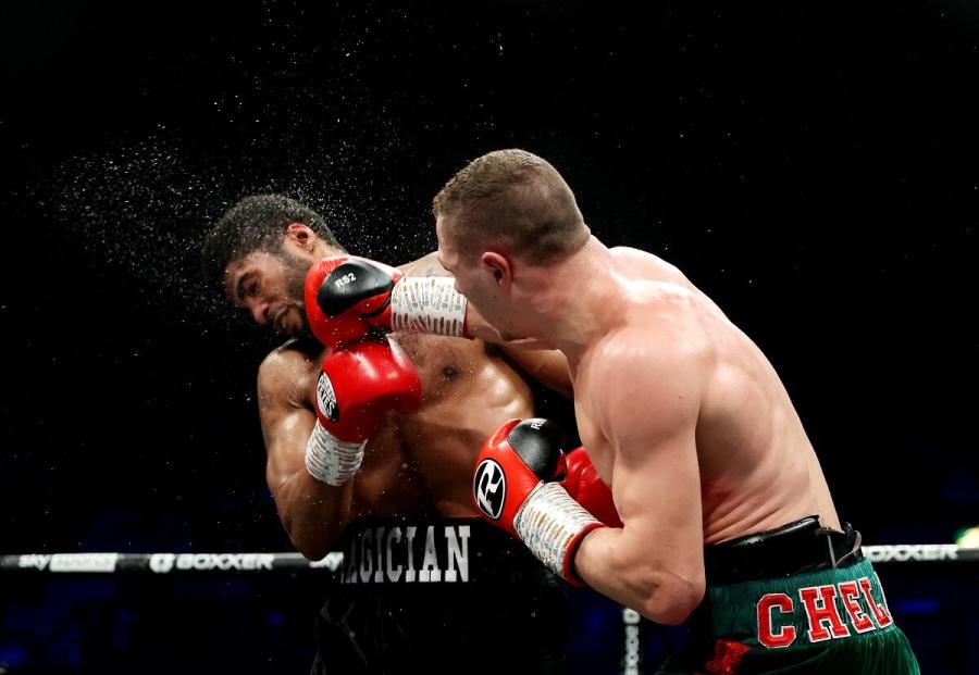 Zak Chelli punches Anthony Sims Jr during their super-middleweight fight at Wembley on 11 February 2023