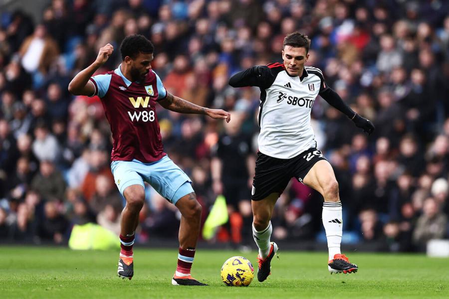Joao Palhinha of Fulham (right) battles for the ball with Lyle Foster of Burnley