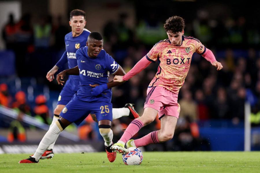 Moises Caicedo of Chelsea (left) pressures Archie Gray of Leeds United (right)