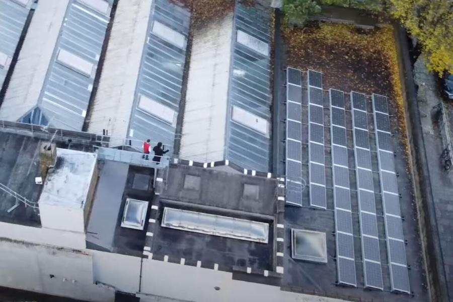 Solar panels on Masbro Community Centre, W14. Pictured: Cllr Rowan Ree (left)