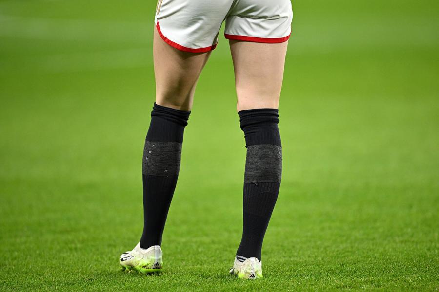 Gaffer tape masking the Nike swoosh on black Chelsea socks as worn by, er, Arsenal