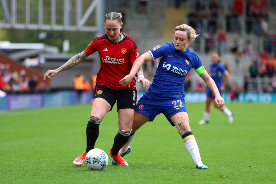 Leah Galton of Manchester United is challenged by Erin Cuthbert of Chelsea