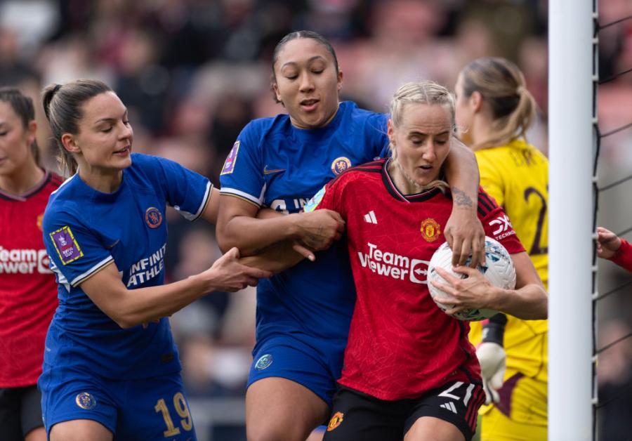 Johanna Rytting Kaneryd and Lauren James attempt to get the ball off Millie Turner of Manchester United