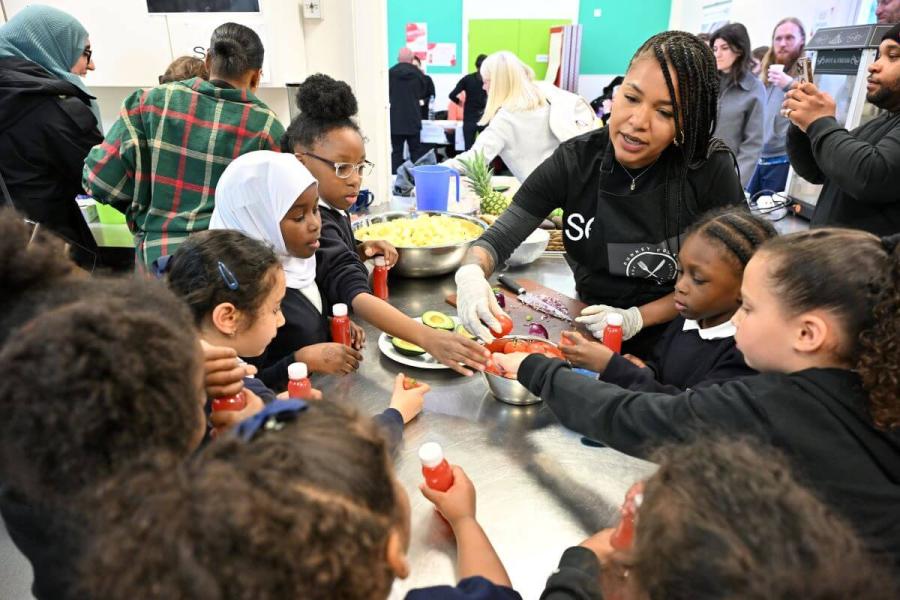 Local children get involved in a cooking demonstration at Family Hub Old Oak Community Centre