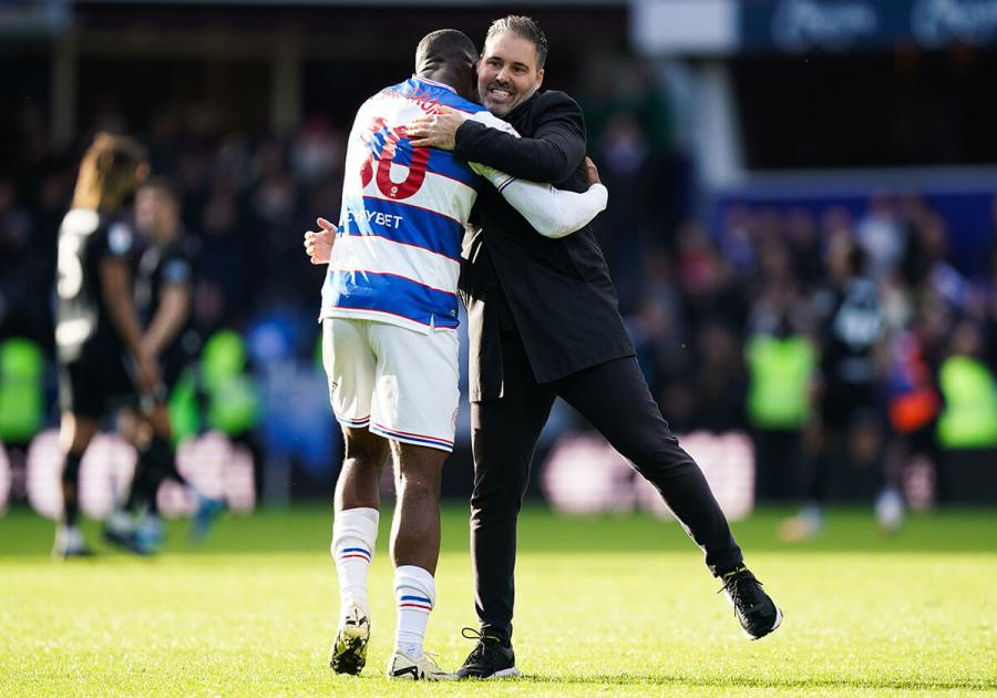 Sinclair Armstrong and Martí Cifuentes embrace on the pitch at Loftus Road in March 2024