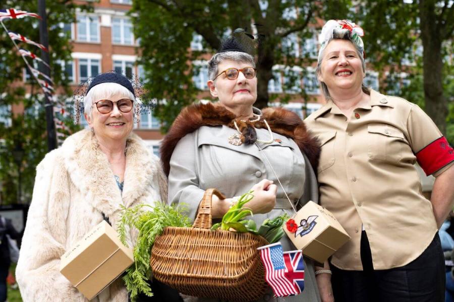 Women in period dress at H&F's D-Day anniversary event, 2024.