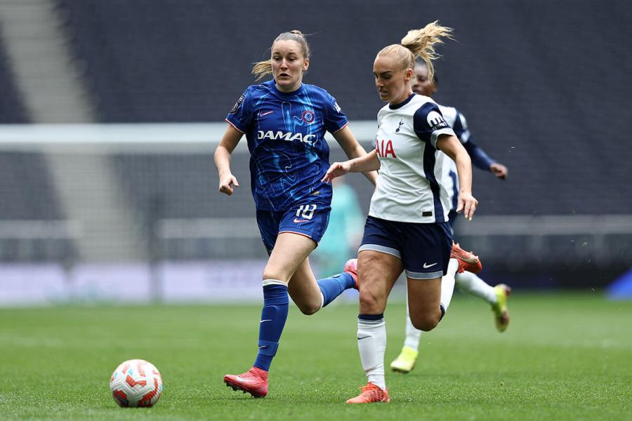 Molly Bartrip and Wieke Kaptein tussle for the ball