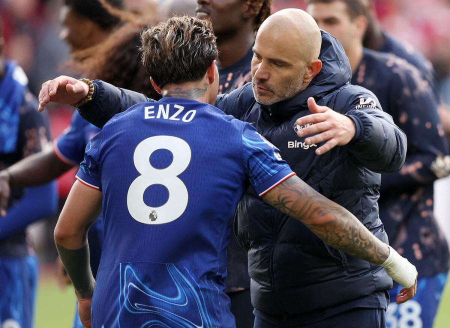 The two Enzos embrace after the victory at Forest