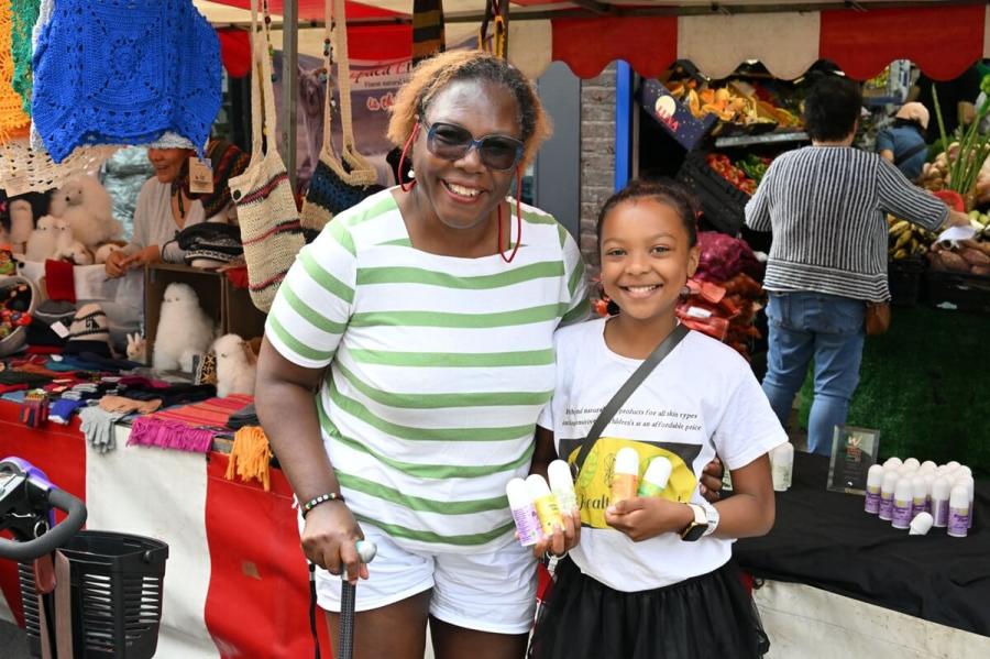 Cllr Sharon Holder (left) and H&F Deputy Youth Mayor Precisa (right) at North End Road summer market in 2023
