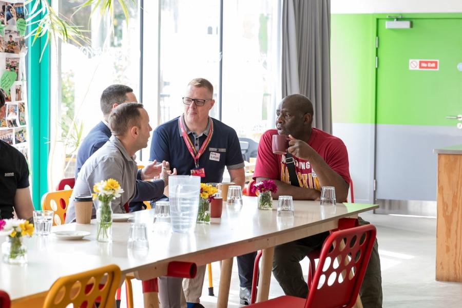 Colleagues discussing working together to build stronger connections for men in H&F.