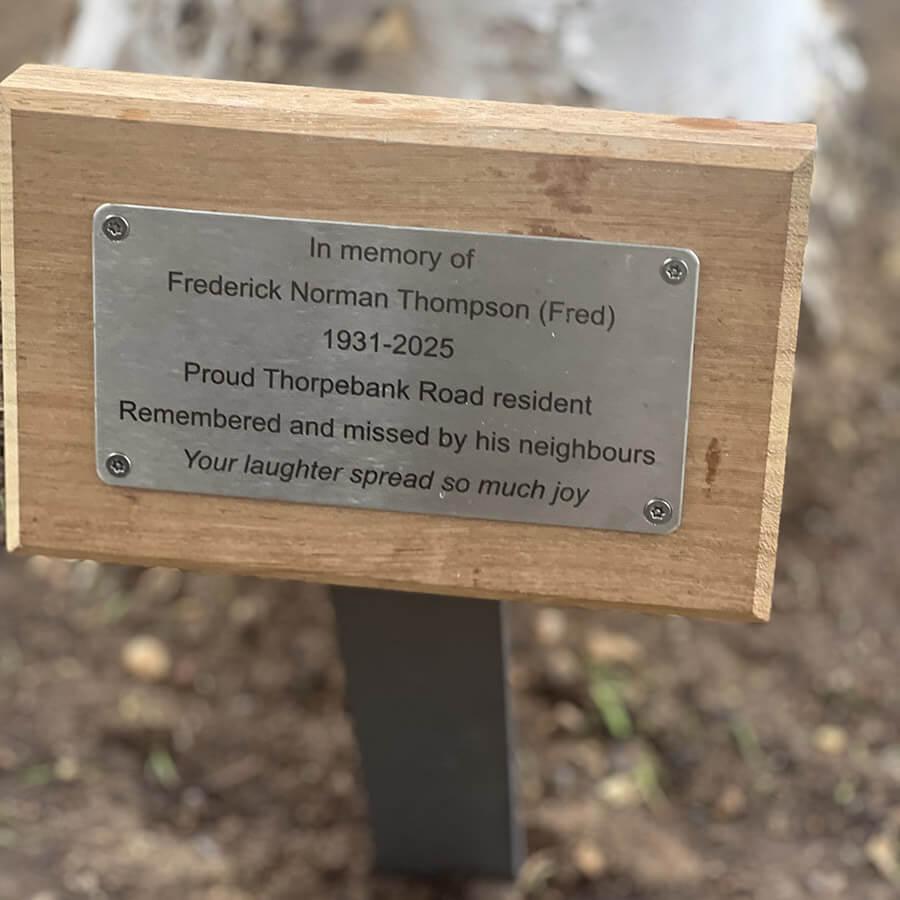 Image of the plaque inscription. It reads: In memory of Frederick Norman Thompson, 1931-2025. Proud Thorpebank Road resident, remembered and missed by his neighbours. Your laughter spread so much joy.