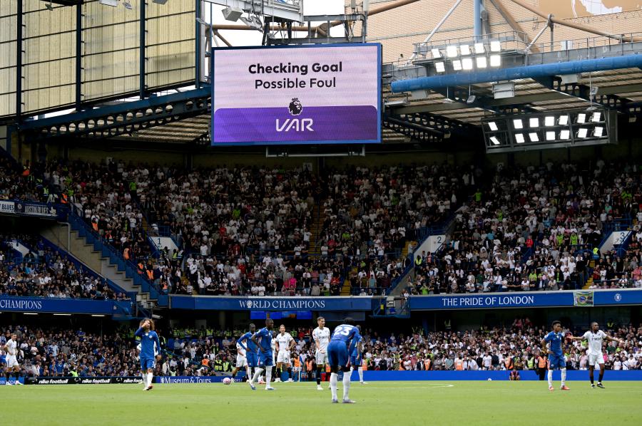 The big screen at Stamford Bridge keeps the fans updated on the decision