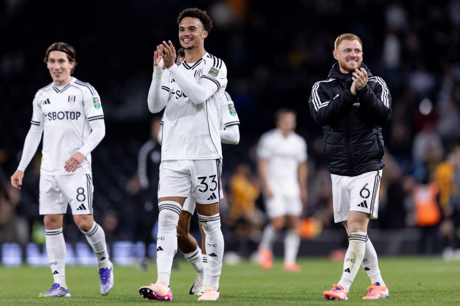  Antonee Robinson and Harrison Reed applaud the fans after beating Cambridge