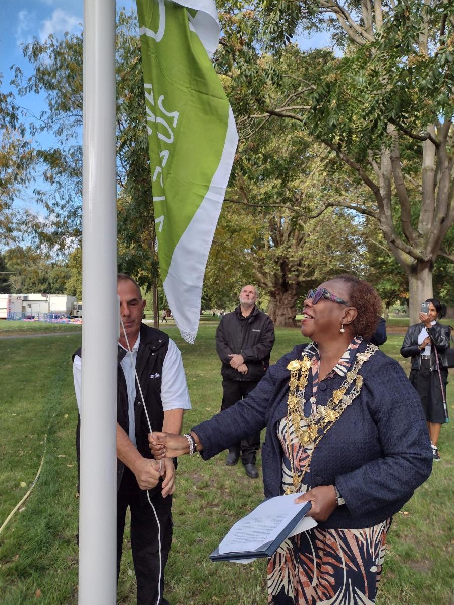 Cllr Holder helps raise the flag