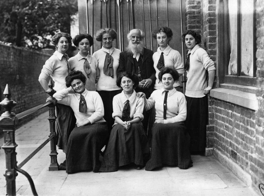 October 1909: Racing boat designer, oarsman and philologist, Dr Frederick James Furnivall (1835-1910), with his ladies rowing eight