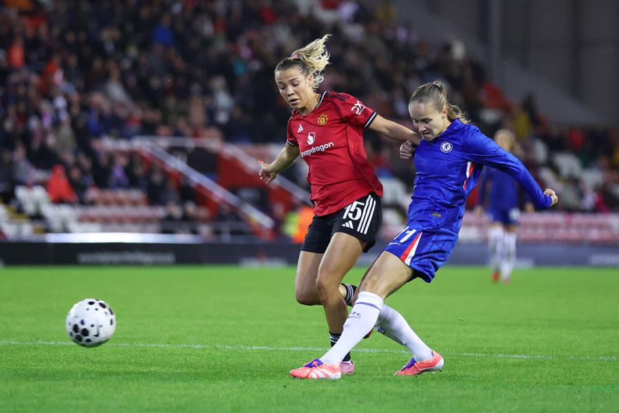 Guro Reiten shoots whilst under pressure from Celin Bizet
