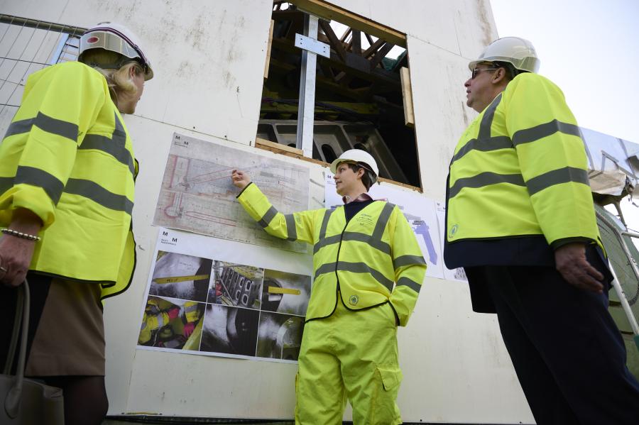 Baroness Vere and Cllr Steve Cowan being shown plans to fix a part of the bridge