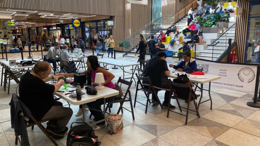 Various tables showing people working to repair electrical items