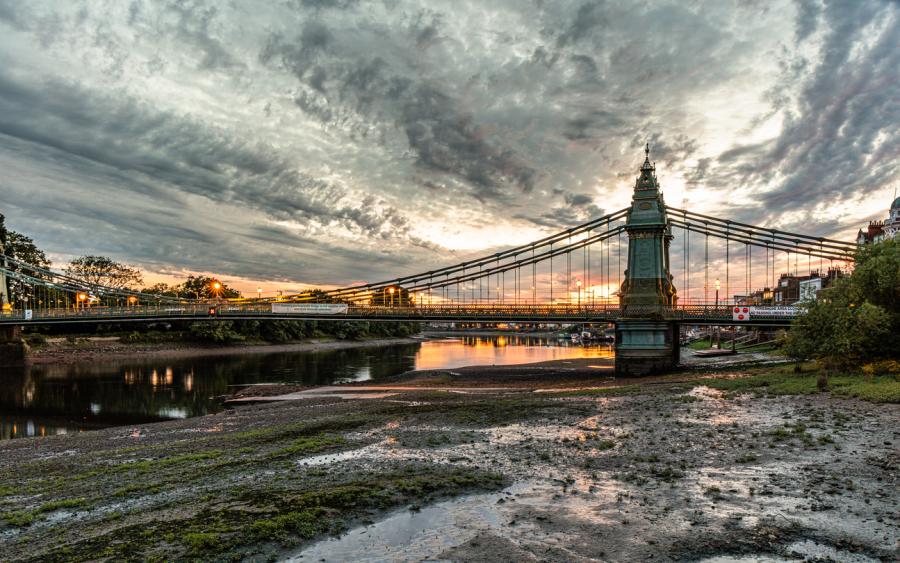 The iconic Hammersmith Bridge at sunset.
