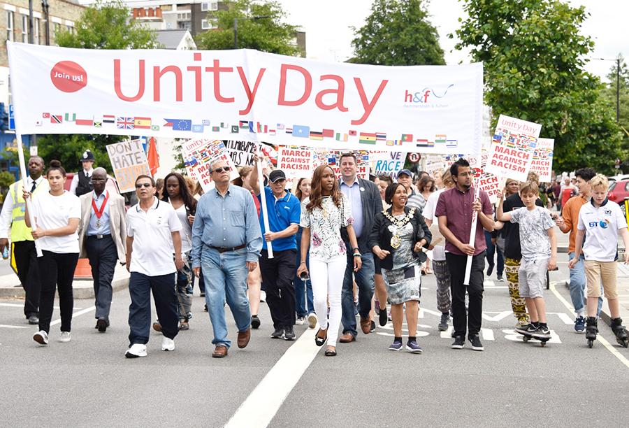 Residents of Hammersmith &amp; Fulham taking part in a march for Unity Day