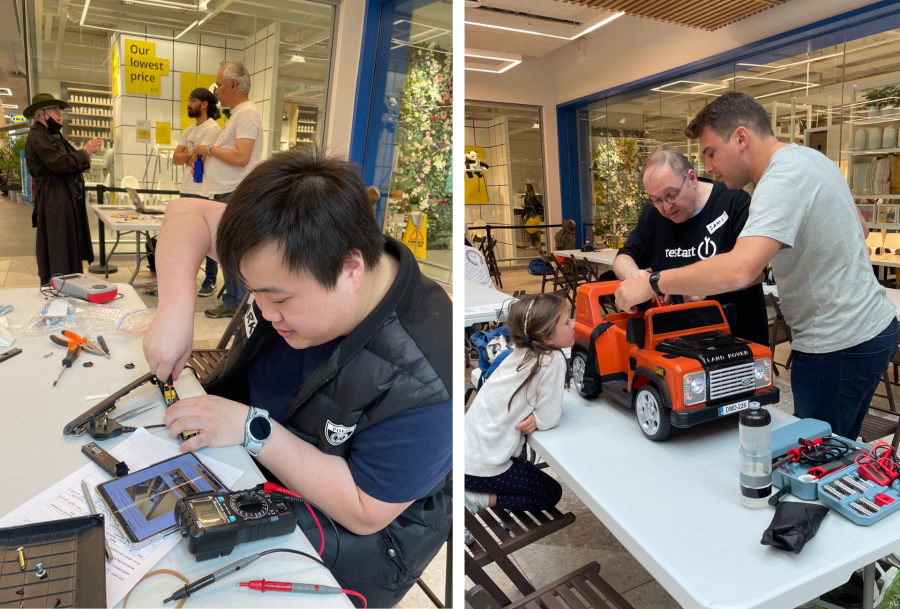 Two men working to fix electricals - one of them is working on a phone, the other one on a toy car.